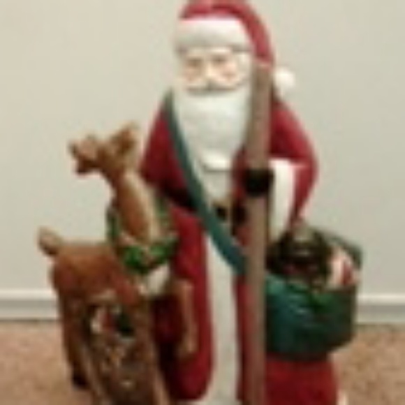 A santa and a raindeer statue - Picture 1 of 1